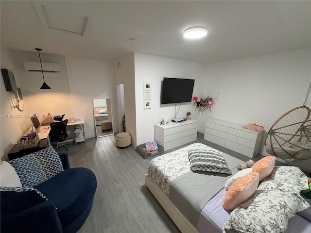 bedroom with hardwood / wood-style floors