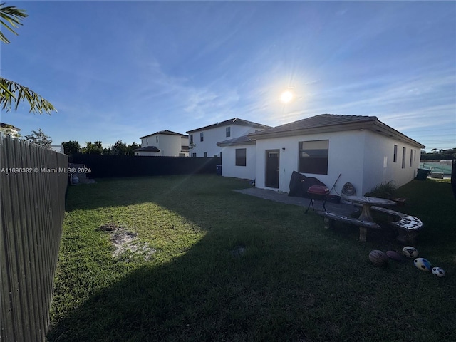 rear view of house with a lawn