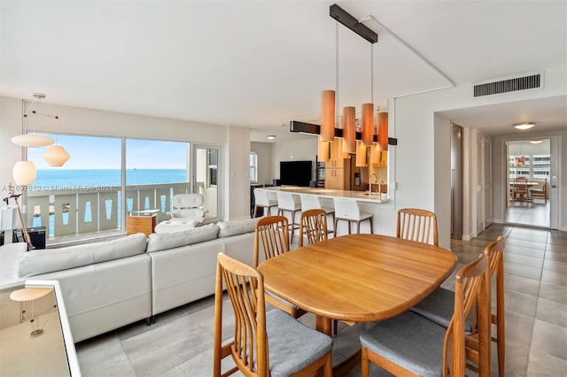 dining area featuring light tile patterned floors and sink