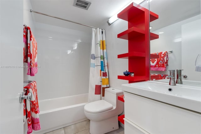 full bathroom featuring tile patterned flooring, vanity, toilet, and shower / bath combo with shower curtain