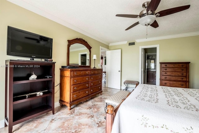 tiled bedroom with a textured ceiling, ensuite bathroom, ceiling fan, and crown molding