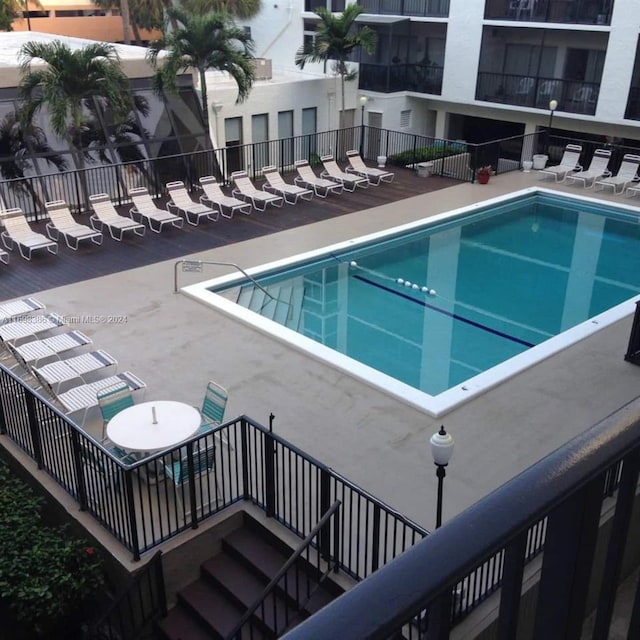 view of swimming pool featuring a patio area