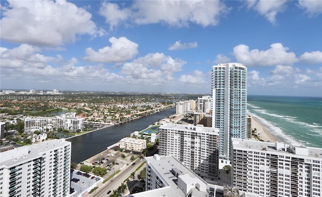 aerial view with a water view and a view of the beach