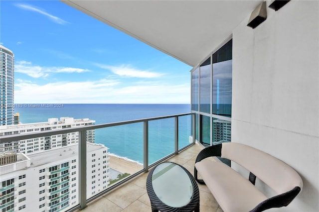 balcony with a view of the beach and a water view