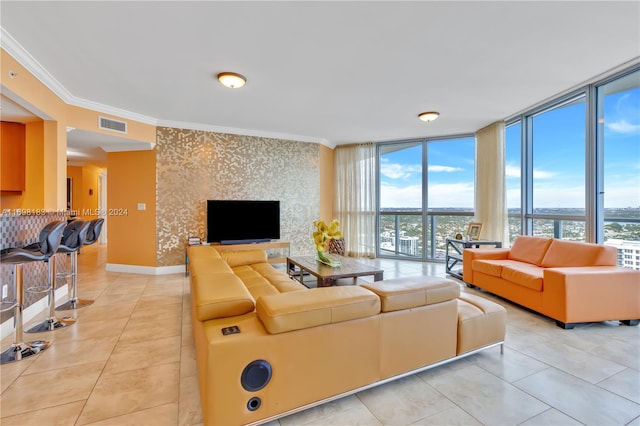 tiled living room with a wall of windows and ornamental molding