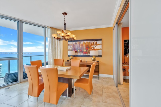 dining space featuring light tile patterned floors, a wall of windows, an inviting chandelier, a water view, and ornamental molding