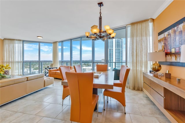 dining area featuring a notable chandelier, light tile patterned flooring, a wall of windows, and ornamental molding