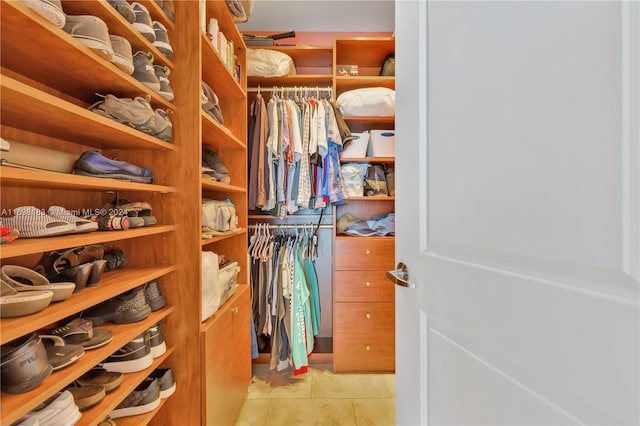 walk in closet featuring light tile patterned floors