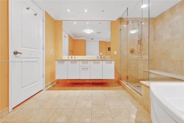 bathroom featuring tile patterned floors, crown molding, vanity, and shower with separate bathtub