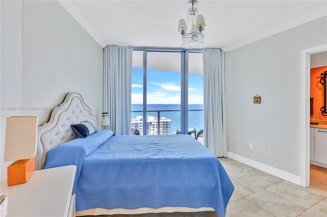 bedroom featuring an inviting chandelier, a water view, ensuite bath, ornamental molding, and light tile patterned flooring