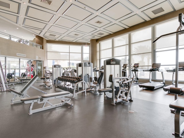 exercise room with plenty of natural light and a wall of windows