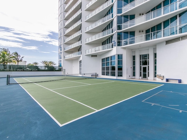 view of sport court featuring basketball hoop