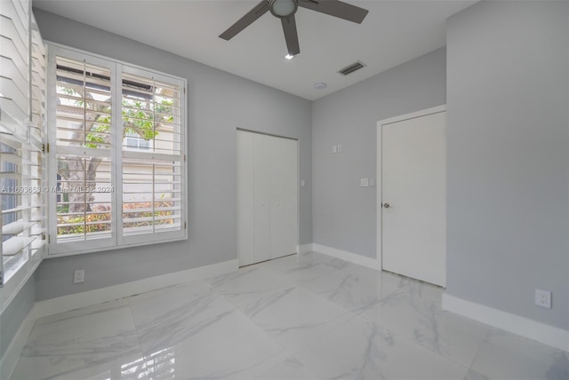 unfurnished room featuring ceiling fan