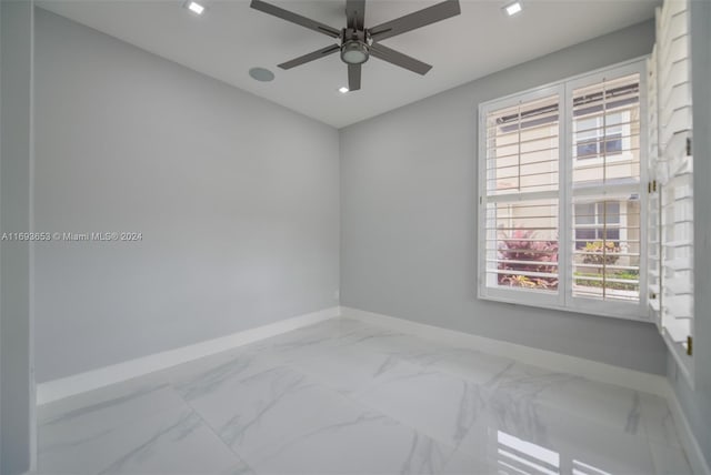 empty room featuring ceiling fan