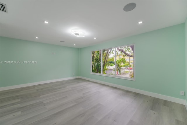 spare room featuring light hardwood / wood-style floors