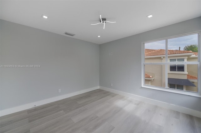 unfurnished room featuring light hardwood / wood-style flooring