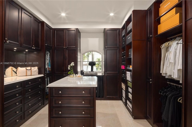 spacious closet featuring light tile patterned flooring