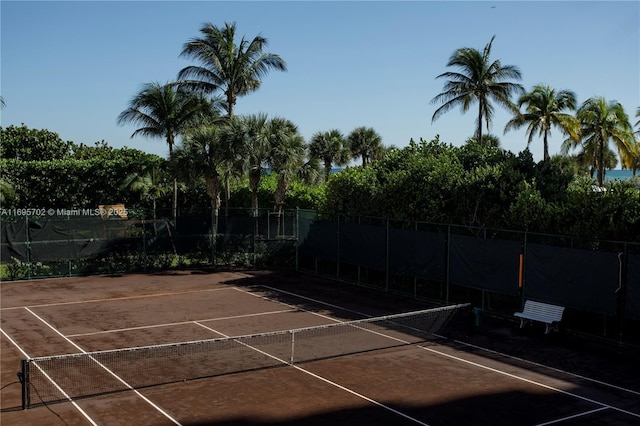 view of sport court with fence