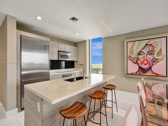16385 Biscayne Blvd Unit 3201/Lph01, North Miami Beach, FL 33160 - kitchen with stainless steel appliances, modern cabinets, a kitchen breakfast bar, light countertops, and a sink