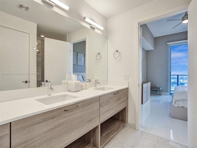 bathroom with ceiling fan and vanity