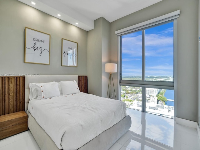 tiled bedroom with access to exterior and multiple windows