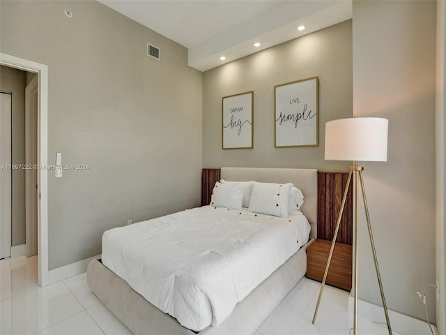 bedroom with light tile patterned floors