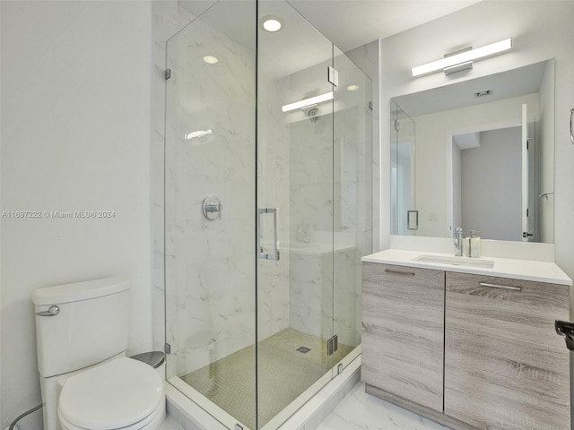 bathroom featuring walk in shower, vanity, and toilet