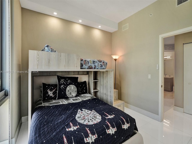 bedroom featuring light tile patterned floors