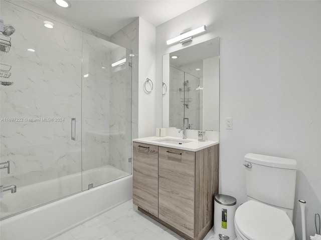 full bathroom with vanity, toilet, and enclosed tub / shower combo