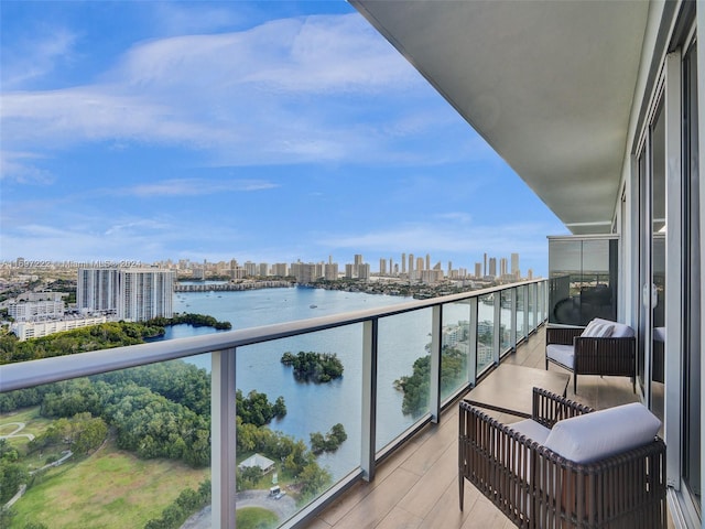 balcony featuring a water view