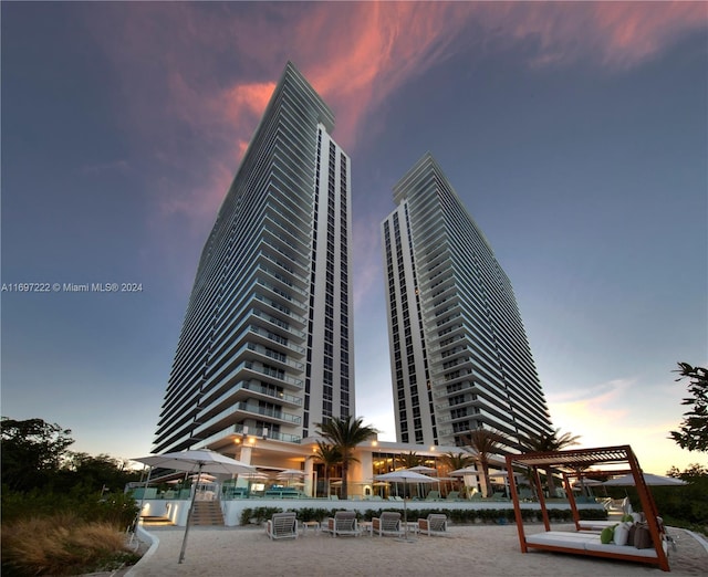 view of outdoor building at dusk