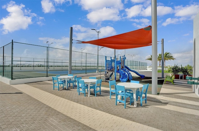 view of playground with tennis court