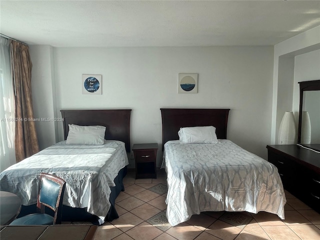 bedroom featuring light tile patterned floors