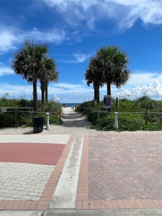 surrounding community featuring a water view