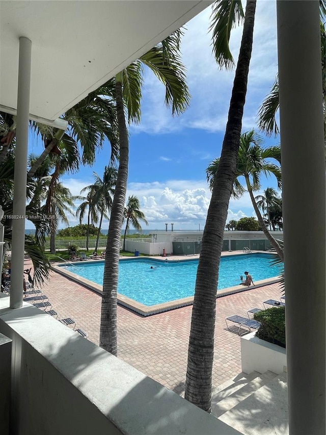 view of swimming pool featuring a patio area