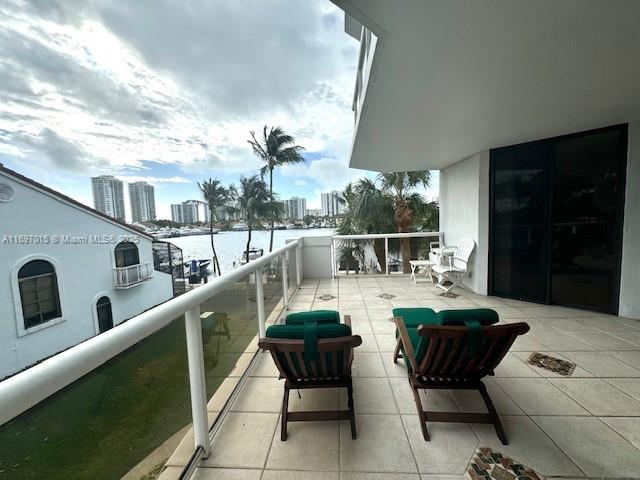 balcony with a city view and a water view