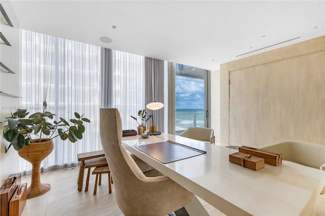 dining area featuring floor to ceiling windows