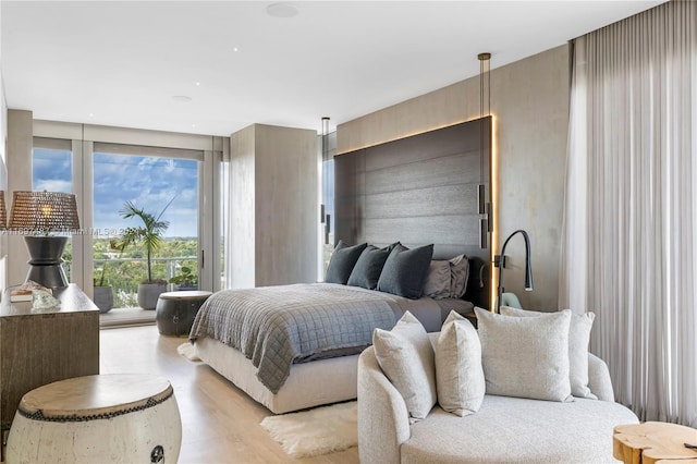 bedroom with light hardwood / wood-style flooring