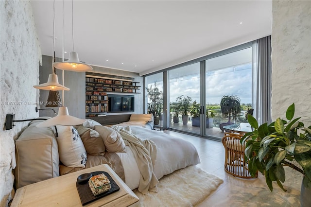 bedroom with access to exterior and floor to ceiling windows