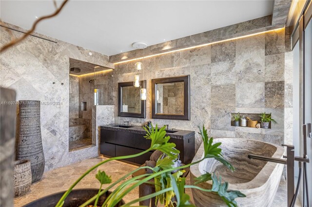 bathroom with vanity and a shower