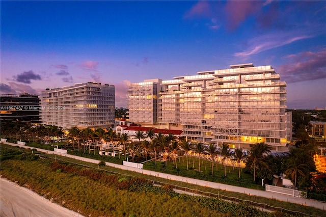 view of outdoor building at dusk