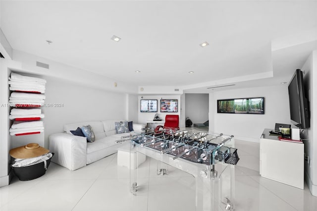 living room with light tile patterned floors