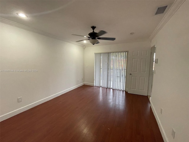 unfurnished room featuring ceiling fan, dark hardwood / wood-style flooring, and ornamental molding