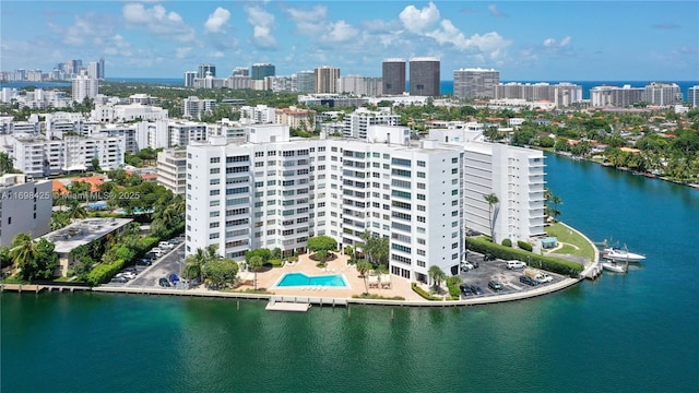 drone / aerial view featuring a water view and a city view