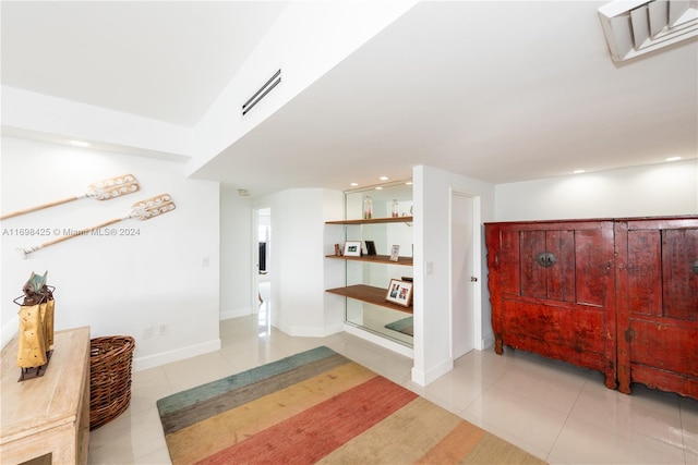 hallway with light tile patterned floors