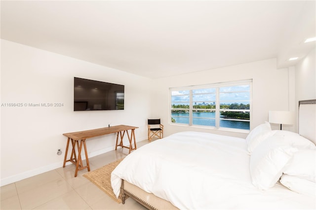 bedroom featuring light tile patterned floors