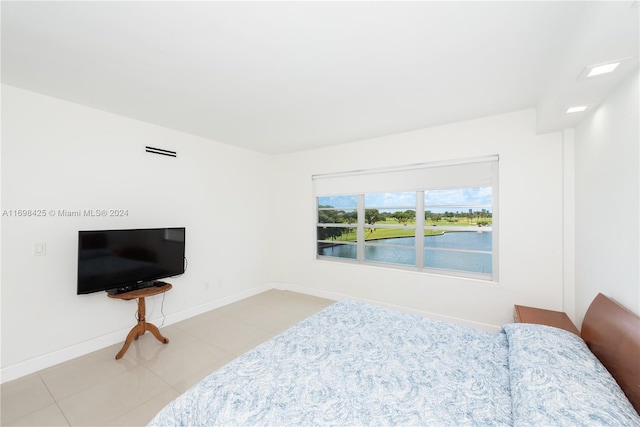 bedroom featuring light tile patterned floors