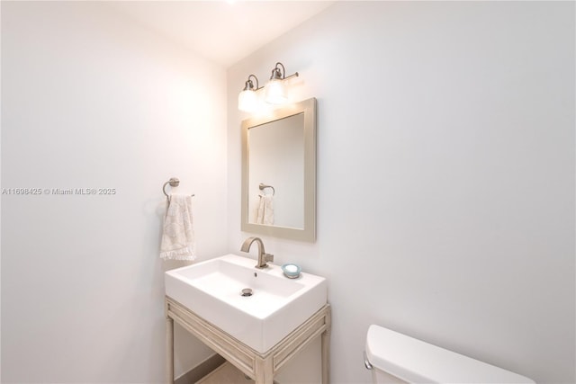 bathroom with vanity and toilet