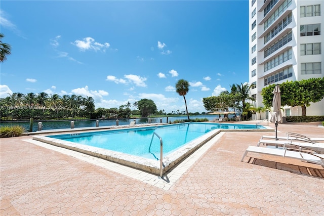 community pool with a patio area