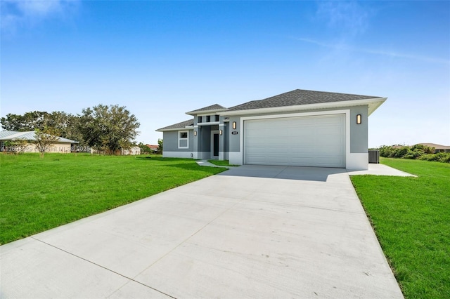 view of front of home with a garage and a front lawn